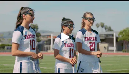 Female athletes celebrating with caps and certificates — high school sports success media.