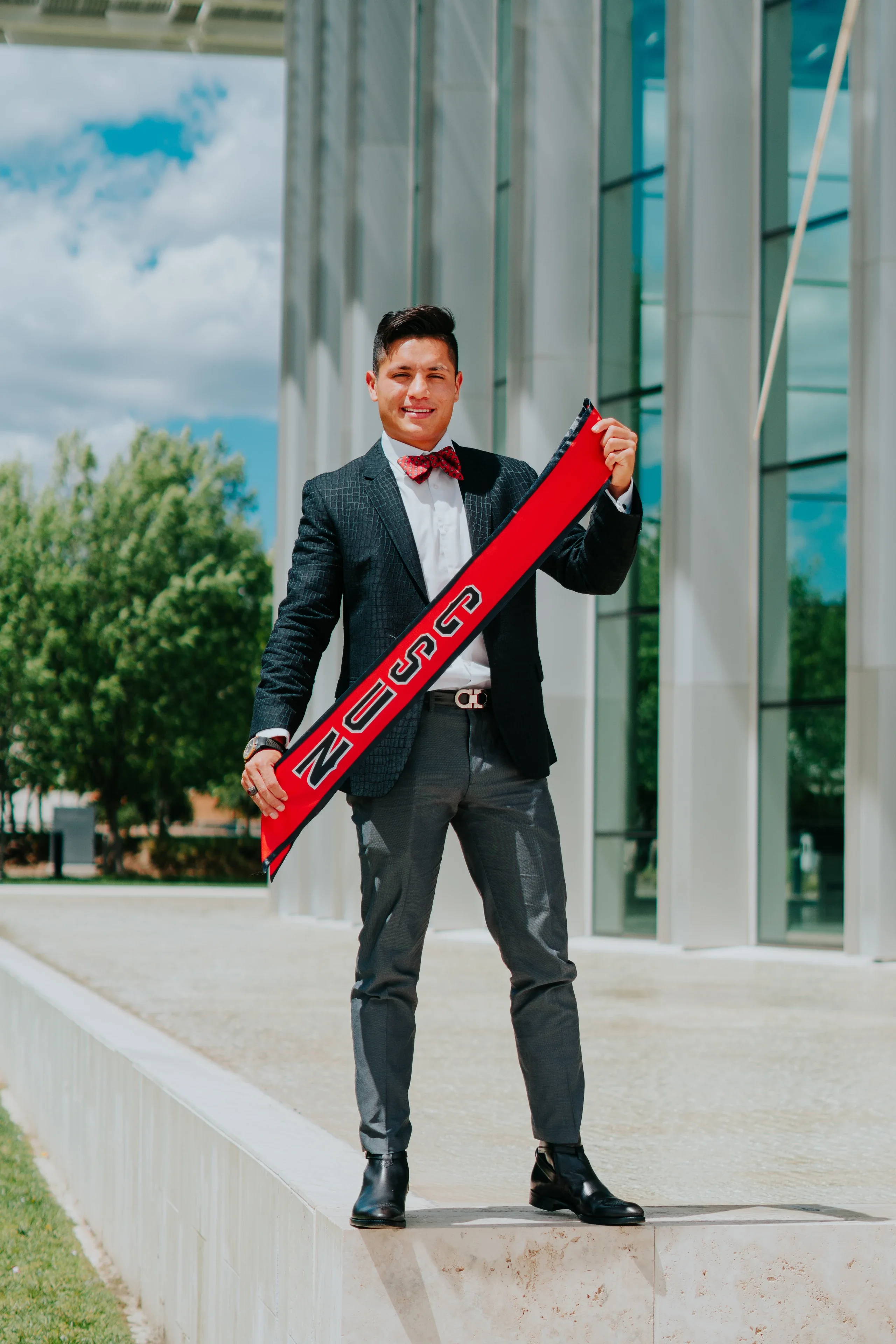 Graduation regalia and dress-shoe detail on the Cal State Fullerton campus