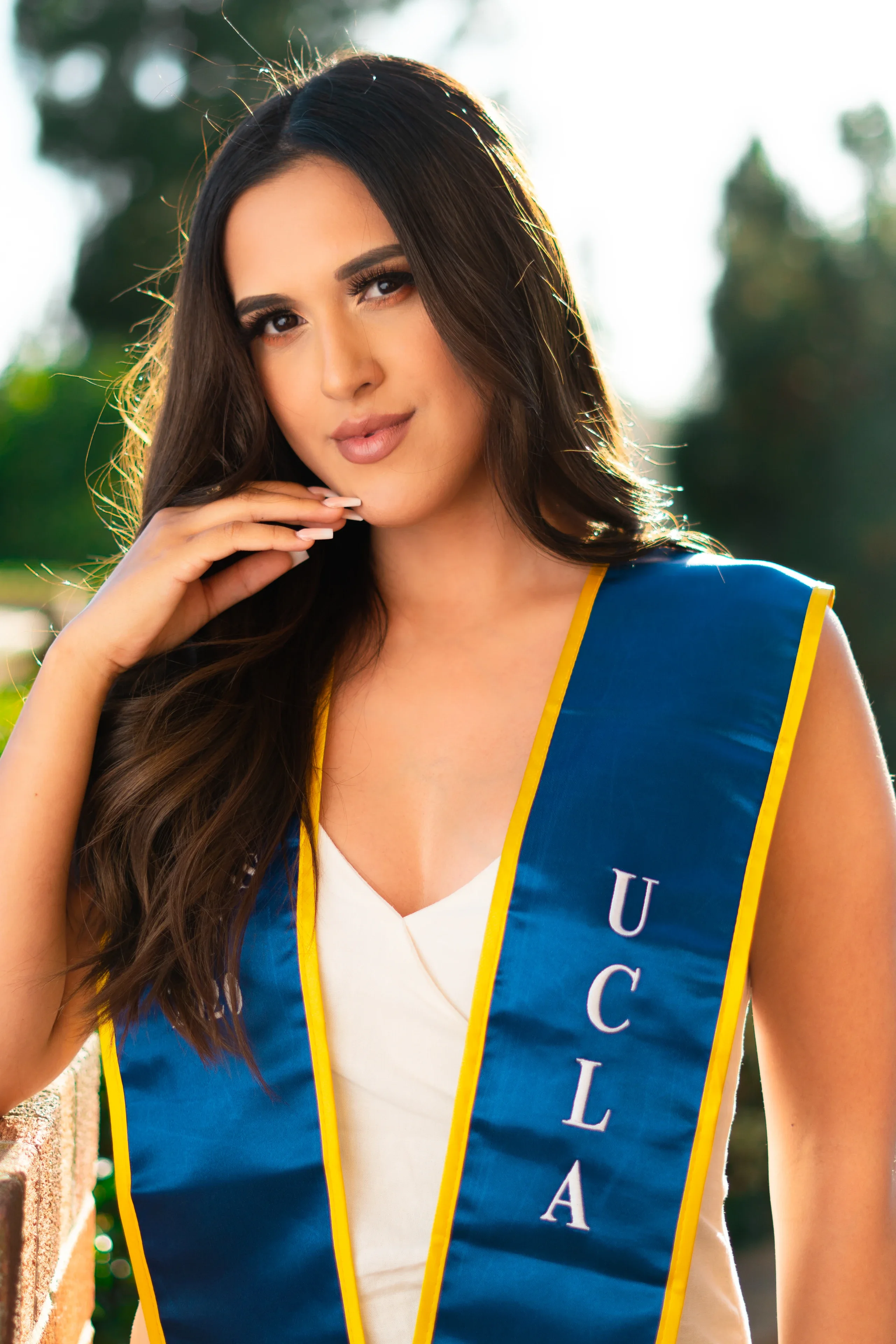 Close detail of a UCLA commencement stole and graduation dress