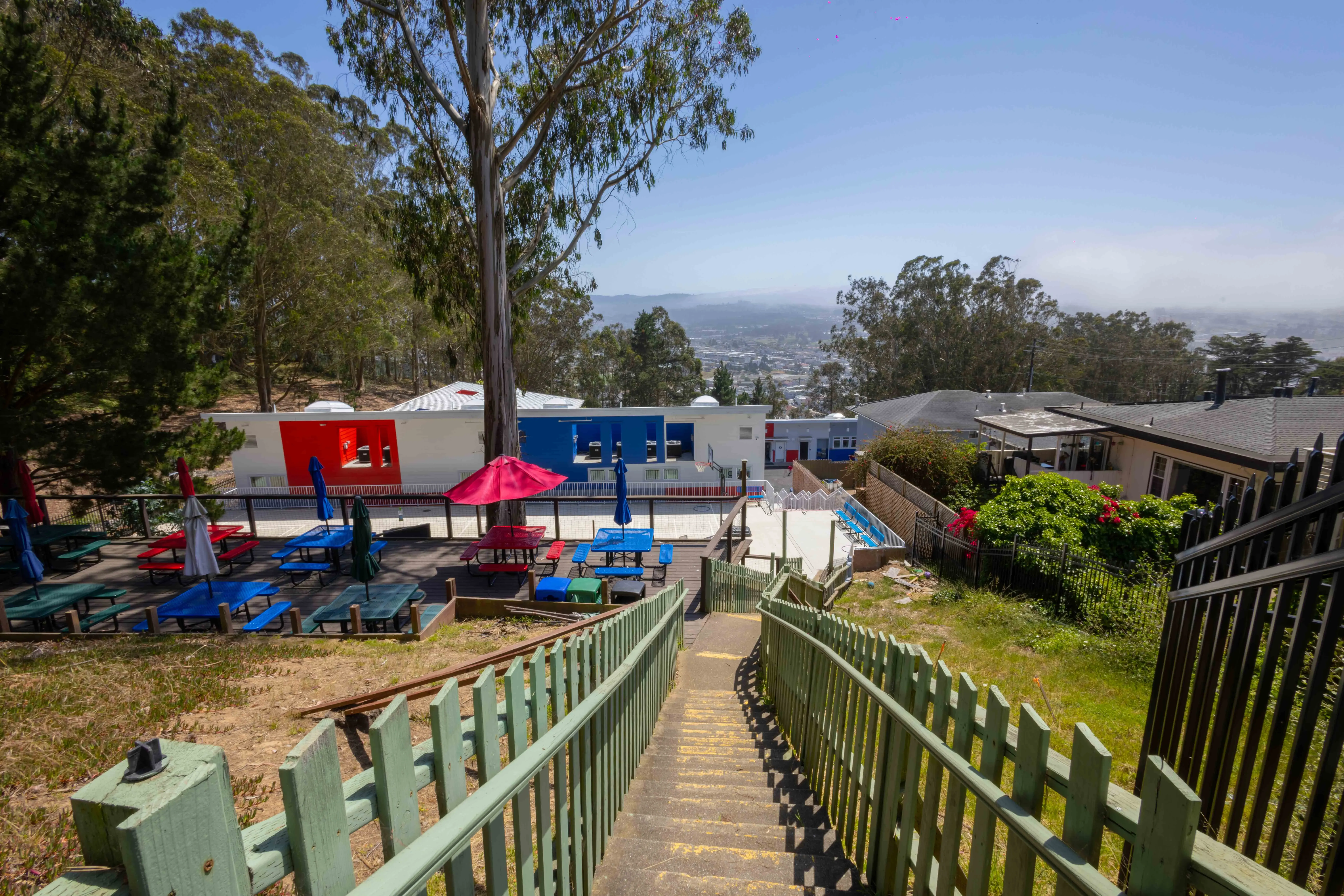 Wide property view showing building access and outdoor space