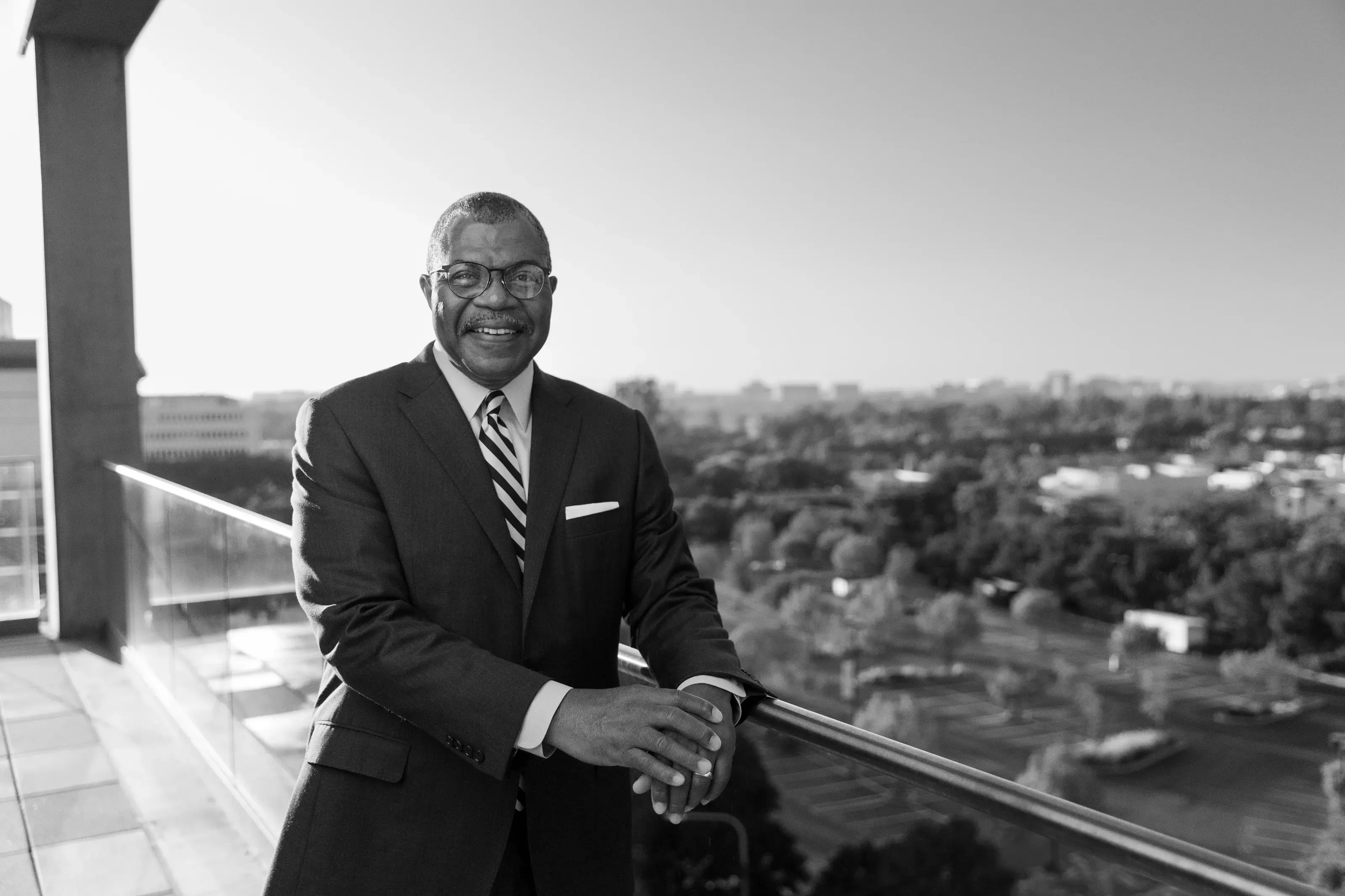 Black-and-white executive portrait overlooking Orange County