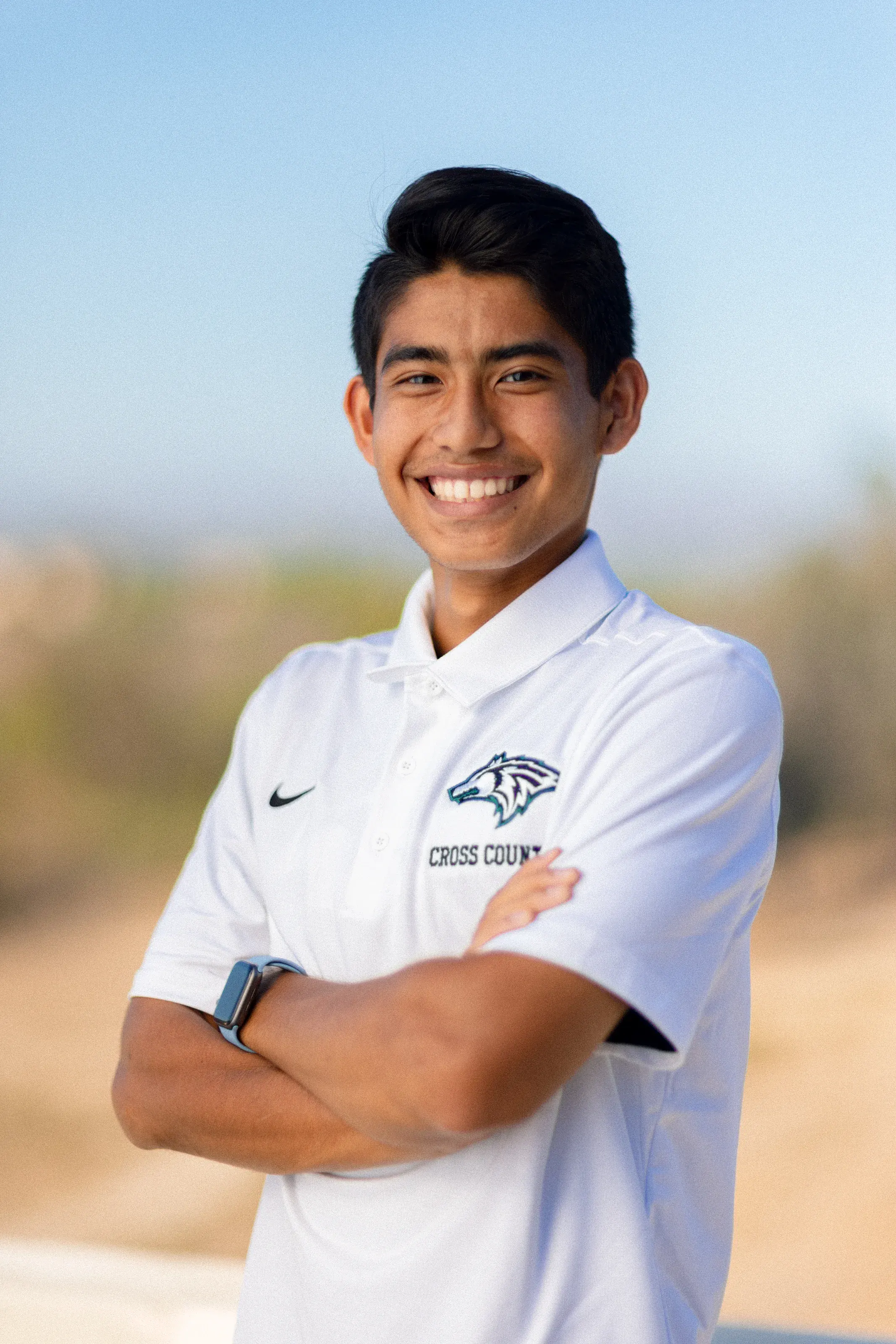 Outdoor student-athlete portrait with a natural landscape background