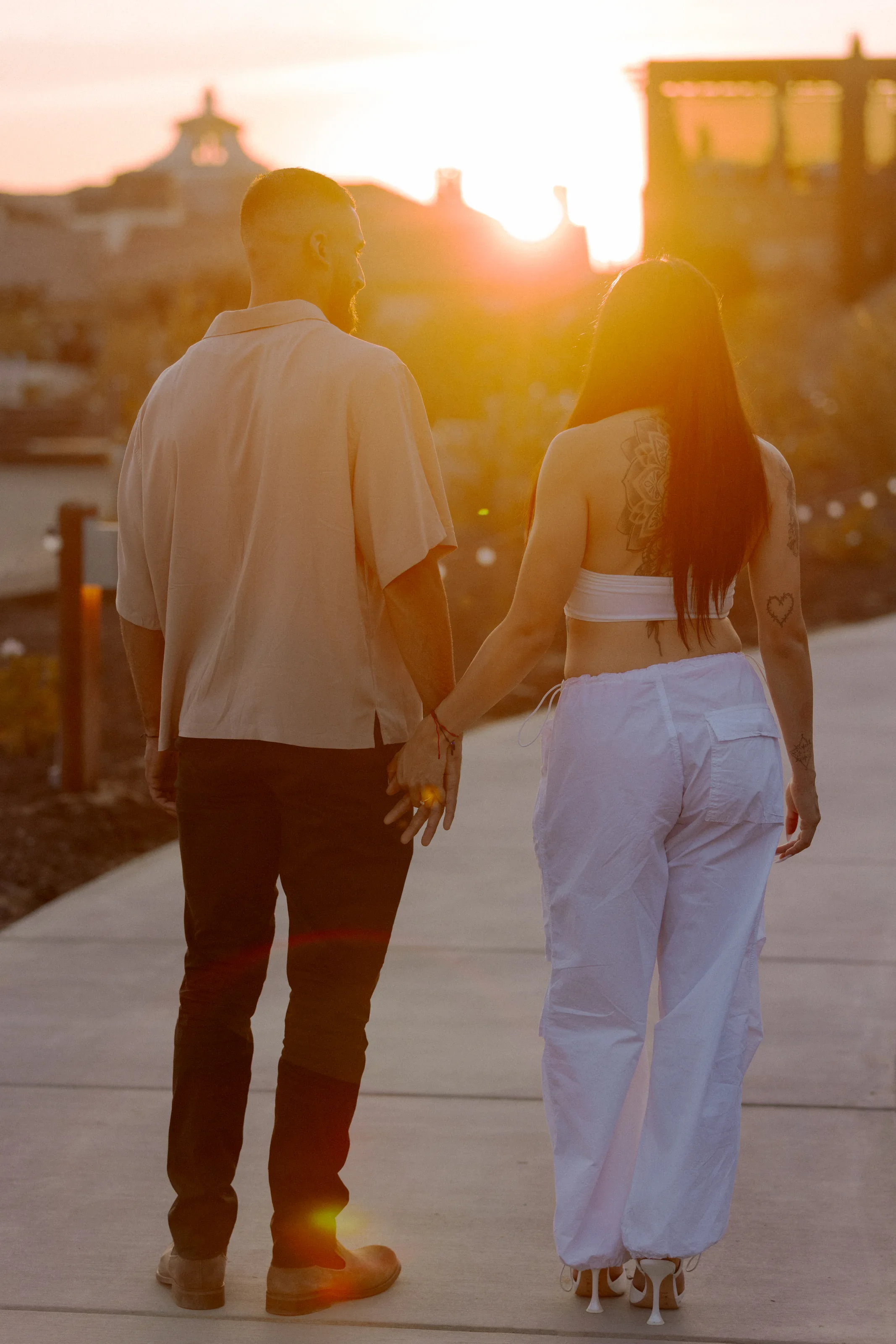Newly engaged couple walking together after the surprise