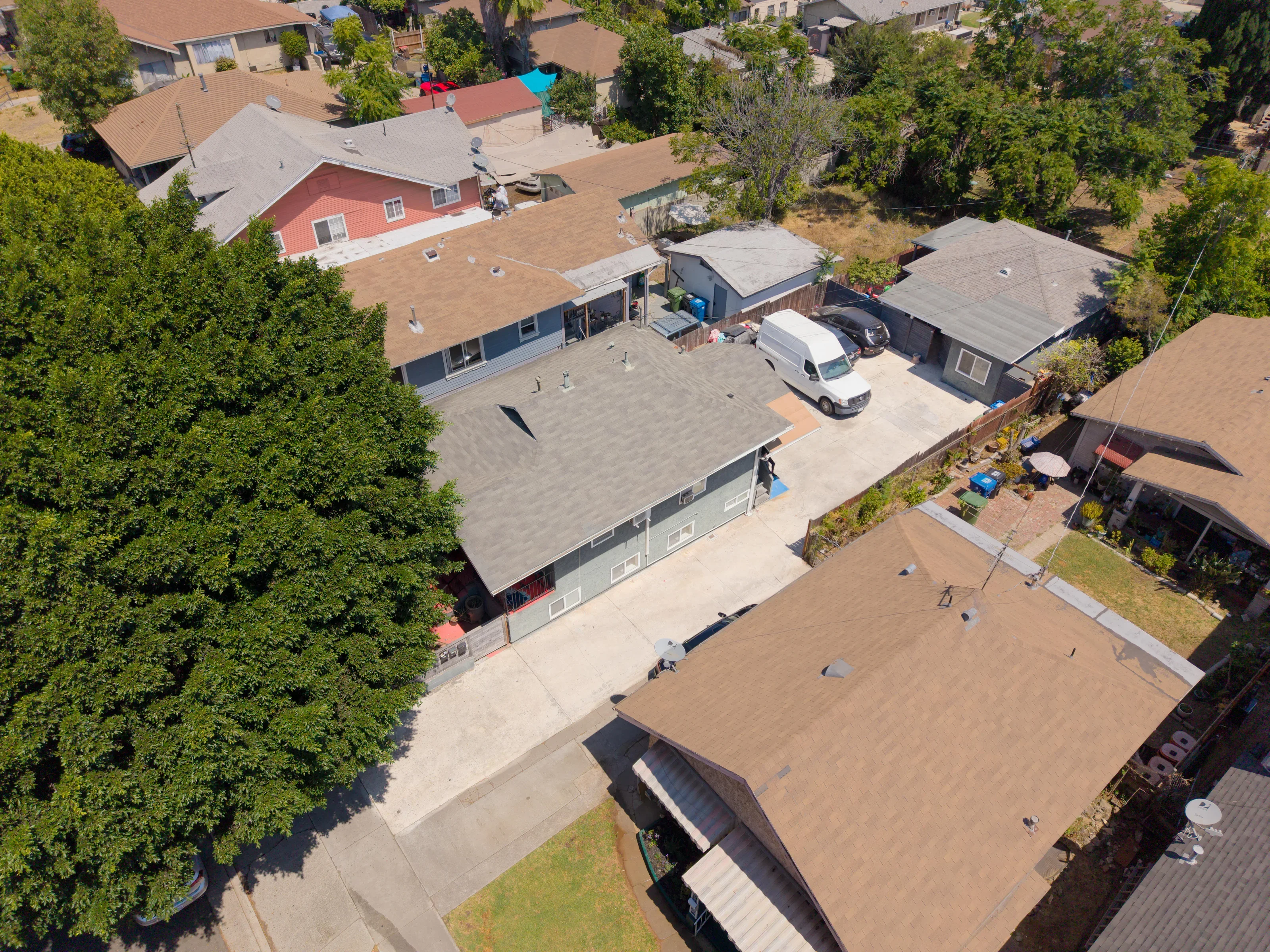 Oblique drone view showing the full parcel and surrounding neighborhood
