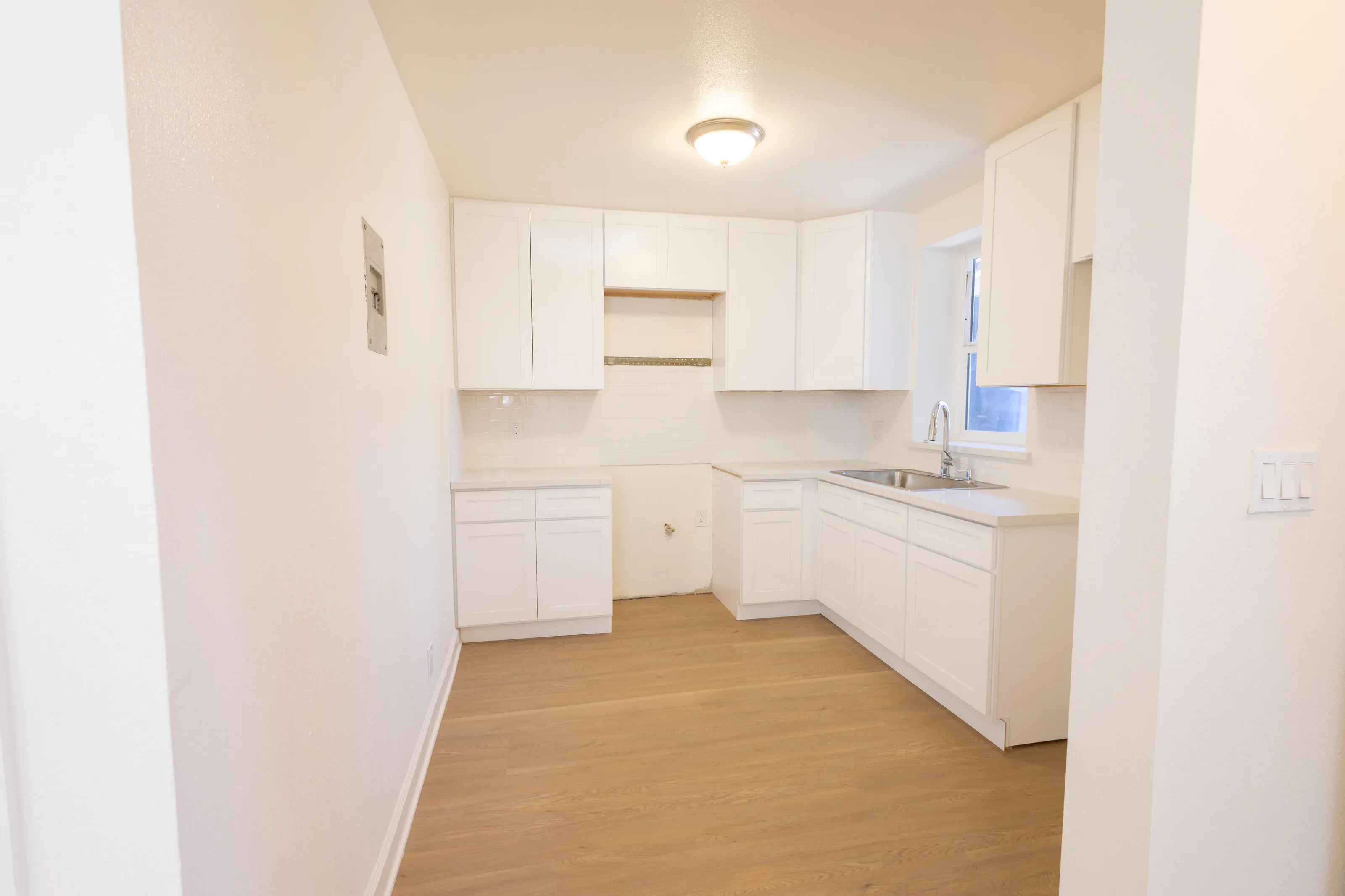 Wide kitchen and dining view showing the layout of the home