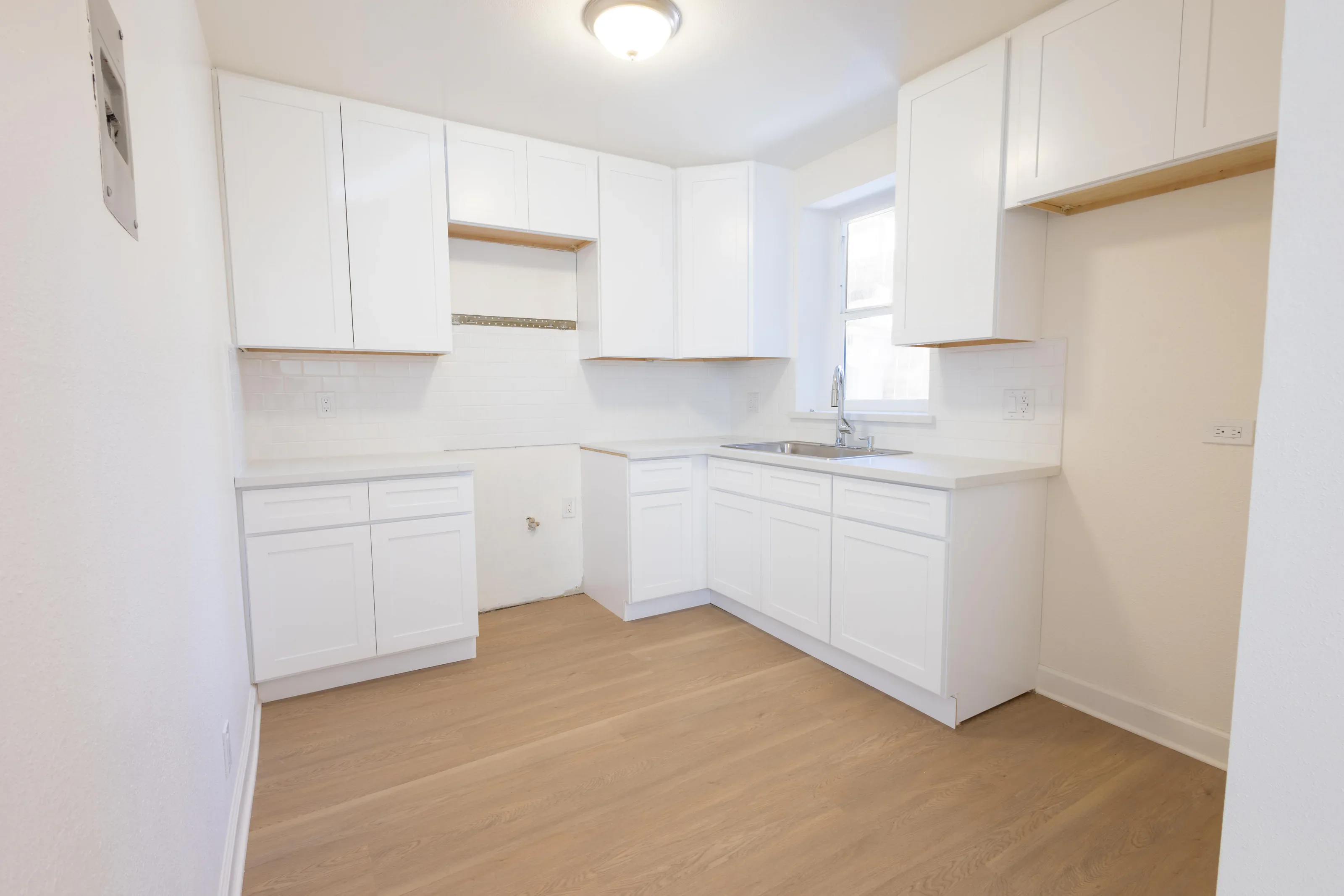 Updated white kitchen photographed for a real estate listing