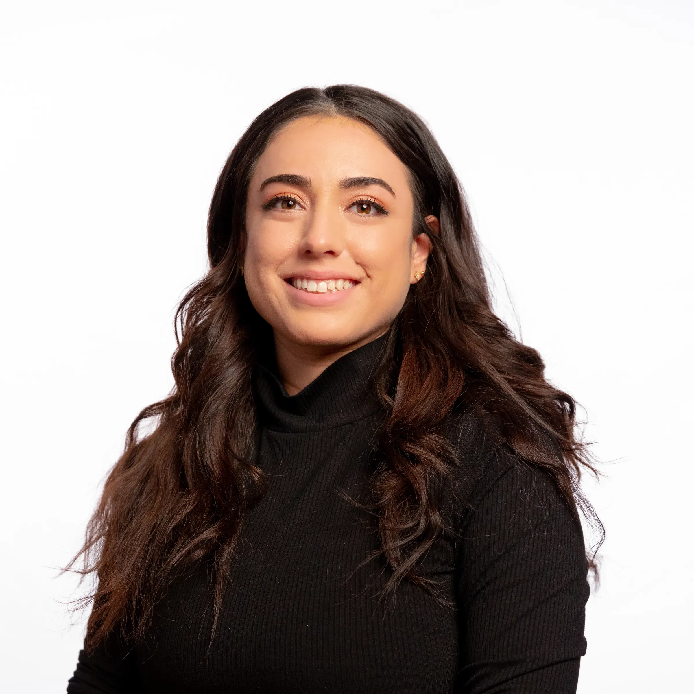 Studio headshot of a professional against a white backdrop