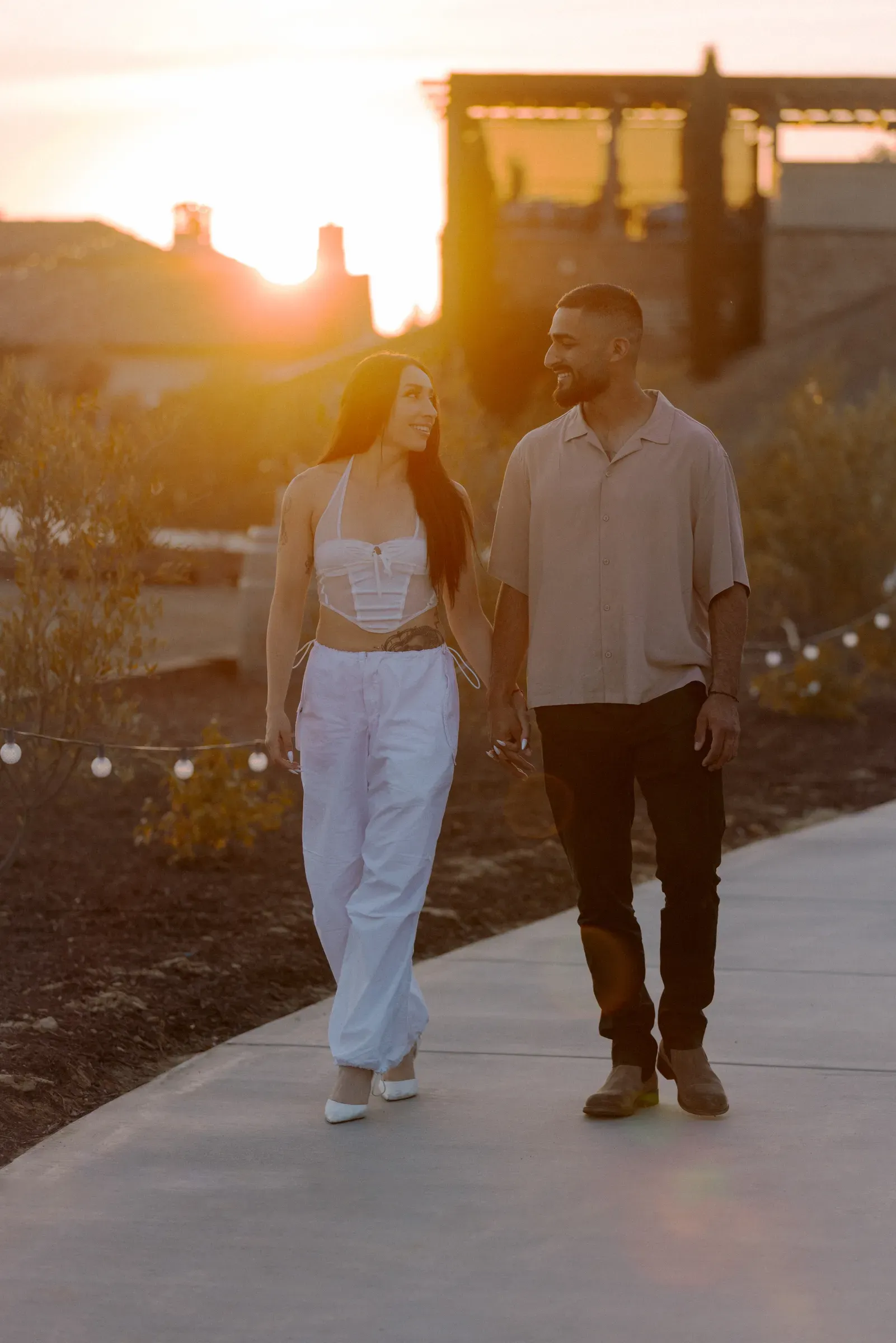 Couple walking together through evening light