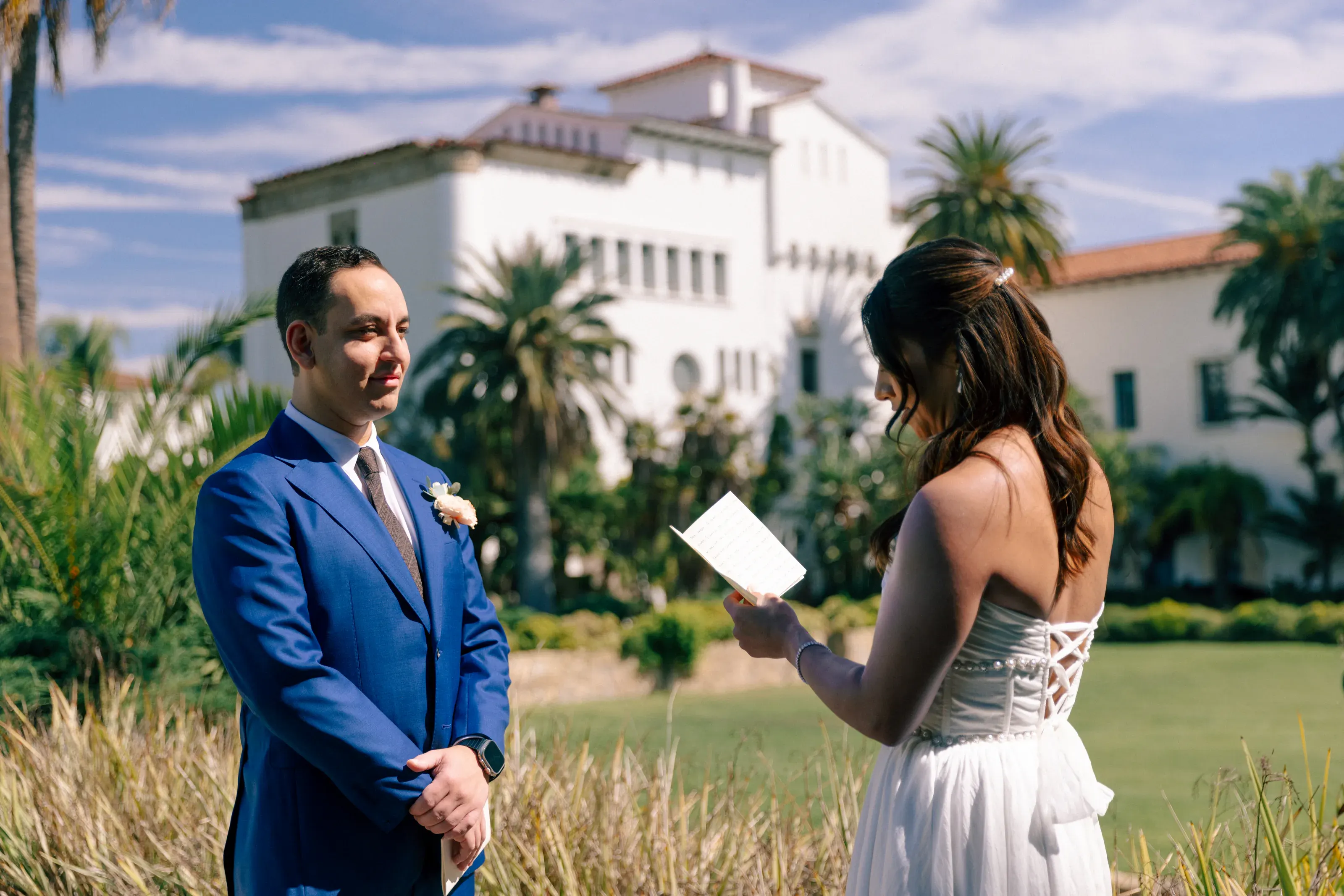 Laura and Daneil exchanging vows outdoors in Santa Barbara