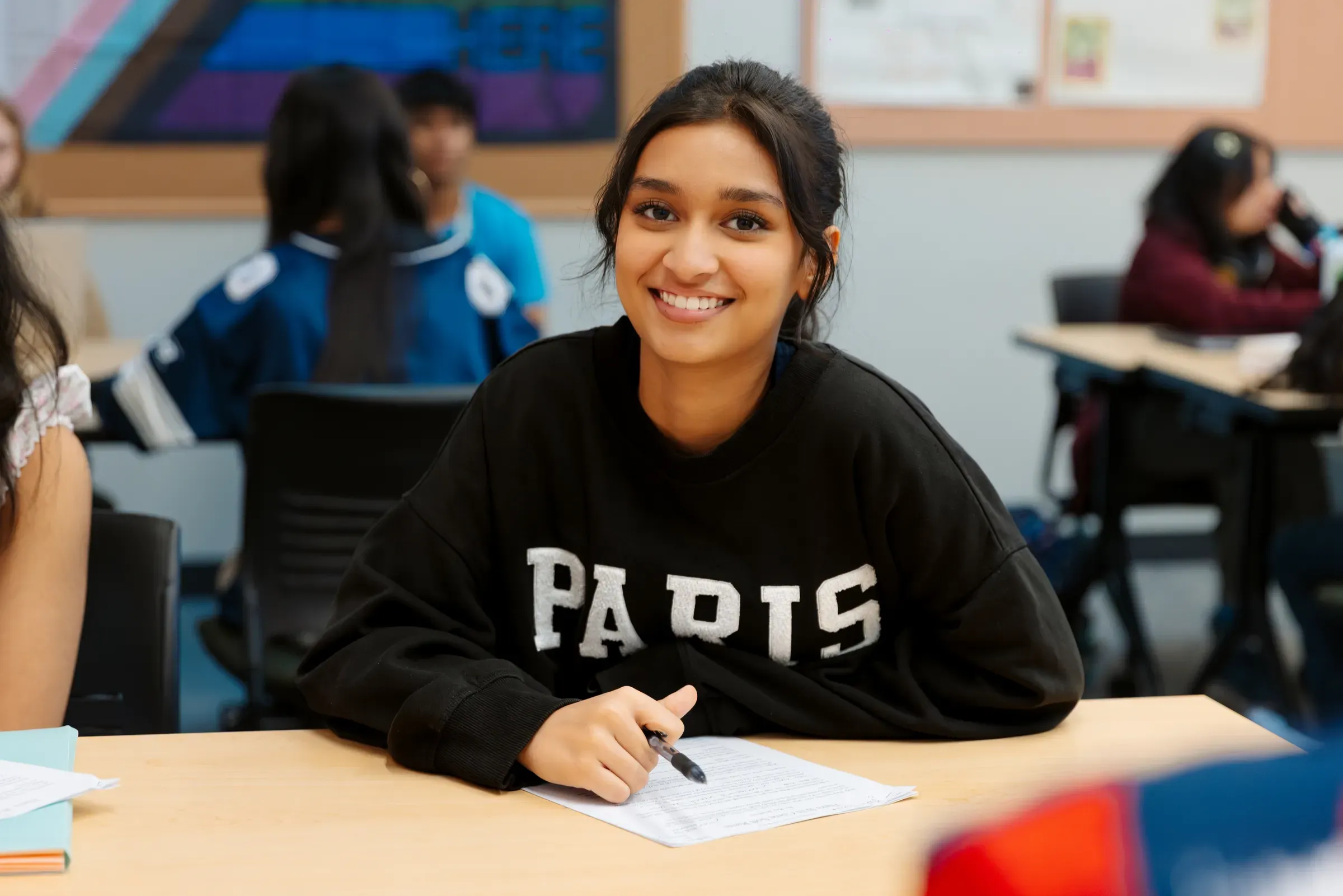 Student focused at their desk during class